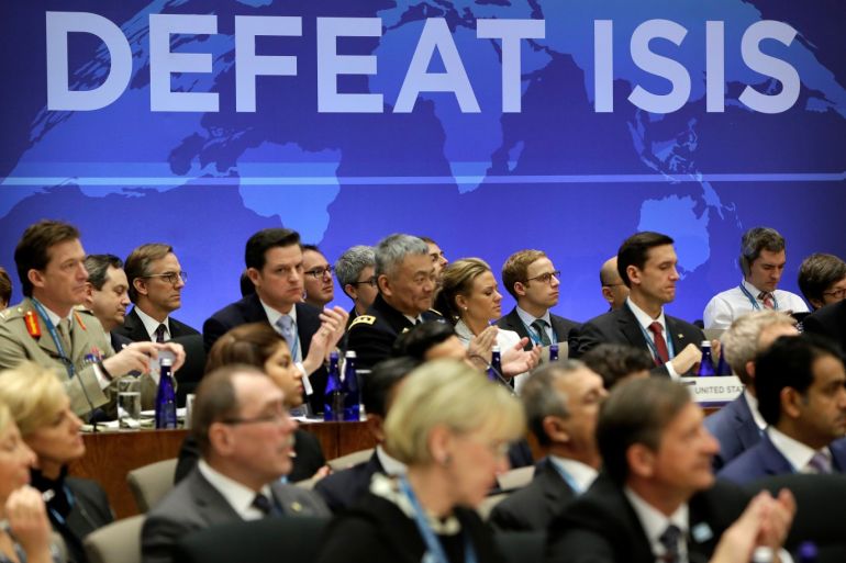 Delegates applaud after remarks at the morning ministerial plenary for the Global Coalition working to Defeat ISIS at the State Department in Washington, U.S., March 22, 2017. REUTERS/Joshua Roberts