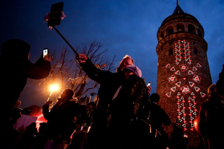 Valentine's Day in Turkey's Istanbul- - ISTANBUL, TURKEY - FEBRUARY 14: Heart figures are reflected on the Galata Tower as people take part in Valentine's Day celebrations in Istanbul, Turkey on February 14, 2019.