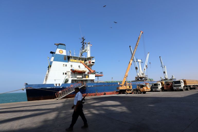 A coast guard walks past a ship docked at the Red Sea port of Hodeidah, Yemen January 5, 2019. Picture taken January 5, 2019. REUTERS/Abduljabbar Zeyad