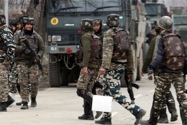 Four Indian soldiers killed in Kashmir gun battle- - KASHMIR, INDIA - FEBRUARY 18: Indian paramilitary soldiers make their way to the encounter site, where nine people including four Indian army men, three militants, a policeman and a civilian were killed in fierce gun-battle between militants, in Pinglena area of Pulwama, Srinagar, Kashmir, India on February 18, 2019.. Police claimed that the master mind militant behind the recent Pulwama suicide attack which killed more that 40 Indian soldiers is one among the militants killed in the gun-battle.