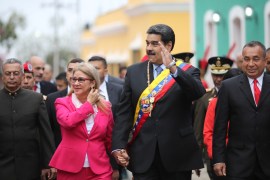 Venezuela's President Nicolas Maduro waves next to his wife Cilia Flores while they attend a ceremony to commemorate the Congress of Angostura in Ciudad Bolivar, Venezuela February 15, 2019. Miraflores Palace/Handout via REUTERS ATTENTION EDITORS - THIS PICTURE WAS PROVIDED BY A THIRD PARTY.