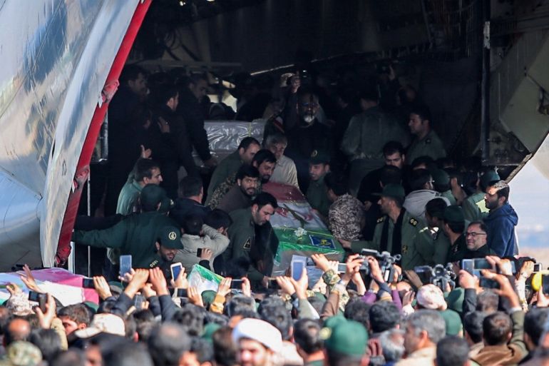 Iranians carry the coffins of members of Iran's elite Revolutionary Guards, who were killed by a suicide car bomb, at Isfahan airport, Iran February 14, 2019. Morteza Salehi/Tasnim News Agency/via REUTERS ATTENTION EDITORS - THIS PICTURE WAS PROVIDED BY A THIRD PARTY