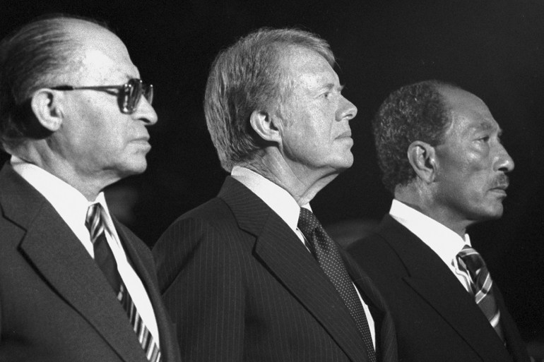 epa04931943 A handout photo provided by the Jimmy Carter Library shows During the Camp David Accords Israel Prime Minister Menachem Begin, US President Jimmy Carter, and Egypt President Anwar Sadat attending a US Marine Corps parade at Camp David, USA, 07 September 1978. EPA/JIMMY CARTER LIBRARY / HANDOUT HANDOUT EDITORIAL USE ONLY