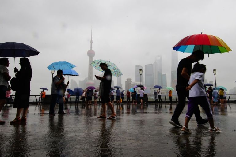 SHANGHAI, CHINA - JULY 22: People visit The Bund after typhoon Ampil landfall on July 22, 2018 in Shanghai, China. Typhoon Ampil made landfall on Chongming Island at 12:30 p.m. Sunday in Shanghai. (Photo by VCG)
