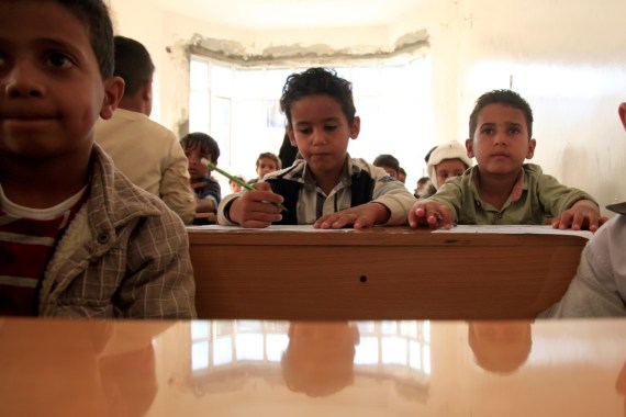 Pupils attend class at their school, damaged by the ongoing war in Taiz, Yemen December 17, 2018. Picture taken December 17, 2018. REUTERS/Anees Mahyoub
