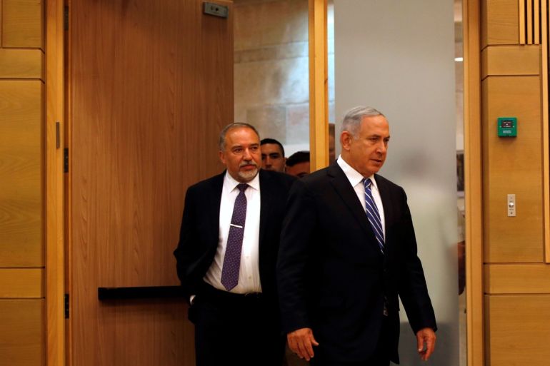 Israeli prime minister Benjamin Netanyahu (R) enters to a media conference together with Israel's new Defence Minister Avigdor Lieberman, head of far-right Yisrael Beitenu party, following Lieberman's swearing-in ceremony at the Knesset, the Israeli parliament, in Jerusalem May 30, 2016. REUTERS/Ronen Zvulun