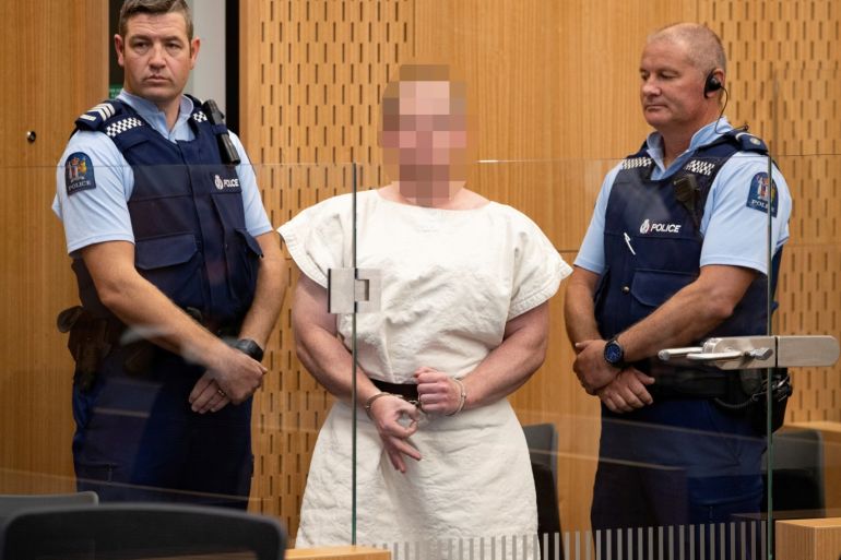 Brenton Tarrant, charged for murder, making a sign to the camera during his appearance in the Christchurch District Court, New Zealand March 16, 2019. Mark Mitchell/New Zealand Herald/Pool via REUTERS. ATTENTION EDITORS - PICTURE PIXELATED AT SOURCE. SUSPECT FACE MUST BE PIXELATED. ONLY HIS FACE. TPX IMAGES OF THE DAY