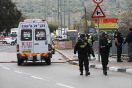epa07444415 Israeli forensic experts and security personnel at the scene of the gun attack at Ariel Junction in the West Bank, 17 March 2019. Reports state that the man is believed to have seized a weapon at Ariel Junction and shot its owner before opening fire in two other separate locations in the West Bank. The Israeli military said in a statement that the latter two shootings had occurred at the Ariel and Gitai intersections. EPA-EFE/ABIR SULTAN