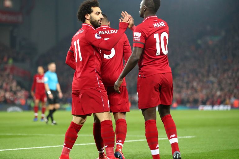 LIVERPOOL, ENGLAND - FEBRUARY 27: Sadio Mane of Liverpool celebrates after scoring his team's first goal with Mohamed Salah of Liverpool during the Premier League match between Liverpool FC and Watford FC at Anfield on February 27, 2019 in Liverpool, United Kingdom. (Photo by Clive Brunskill/Getty Images)
