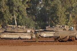 epa07463888 Israeli Merkava tanks and APCs sit at a gathering point next to the border with Gaza, 26 March 2019. Israeli army is targeting Hamas militant installations in the Gaza Strip in response to a rocket fired from Gaza Strip that hit a house in central Israel. EPA-EFE/ATEF SAFADI