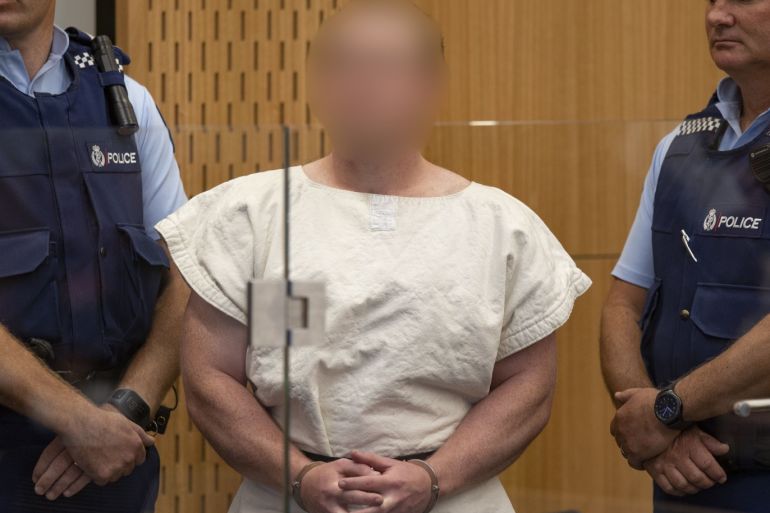 CHRISTCHURCH, NEW ZEALAND - MARCH 16: (EDITOR'S NOTE: Parts of this image have been pixelated at source to conceal the identity of the defendant due to court order.) The man charged in relation to the Christchurch massacre, Brenton Tarrant, in the dock for his appearance for murder in the Christchurch District Court on March 16, 2019 in Christchurch, New Zealand. At least 49 people are confirmed dead, with more than 40 people injured following attacks on two mosques in
