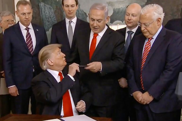 Prime Minister of Israel Benjamin Netanyahu (Back C) holds up the pen used by US President Donald J. Trump (Front C) to sign an order recognizing Golan Heights as Israeli territory, in the Diplomatic Reception Room of the White House in Washington, DC, USA, 25 March 2019