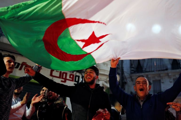 People celebrate on the streets after President Abdelaziz Bouteflika announced he will not run for a fifth term, in Algiers, Algeria March 11, 2019. REUTERS/Zohra Bensemra