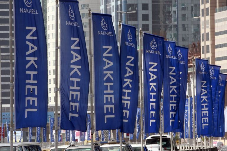 Flags for property company Nakheel are seen on the Sheik Zayed highway in Dubai December 14, 2009. Abu Dhabi stepped in to help fellow United Arab Emirates member Dubai with a $10 billion (6.1 billion pound) injection, of which $4.1 billion was allocated to troubled state-owned conglomerate Dubai World to pay immediate obligations, Dubai said on Monday.REUTERS/Mosab Omar (UNITED ARAB EMIRATES - Tags: BUSINESS)