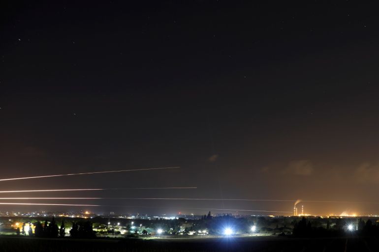 Streaks of light are pictured as rockets are launched from the Gaza Strip towards Israel, as seen from the Israeli side of the border March 25, 2019 REUTERS/Amir Cohen