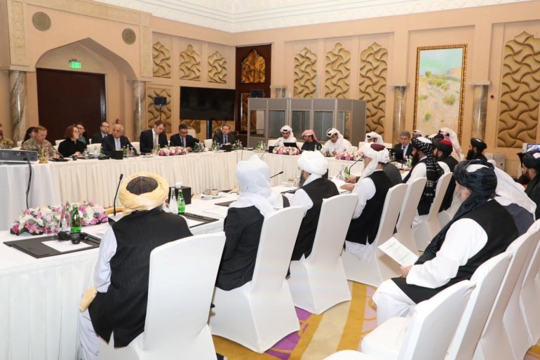 Undated handout picture of U.S., Taliban and Qatar officials during a meeting for peace talks in Doha, Qatar. Qatari Foreign Ministry/Handout via REUTERS ATTENTION EDITORS - THIS PICTURE WAS PROVIDED BY A THIRD PARTY.