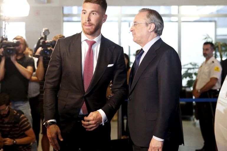 Real Madrid president Florentino Perez (R) stands with Real Madrid defender Sergio Ramos at Santiago Bernabeu stadium in Madrid, Spain, August 17, 2015. Ramos has agreed to extend his contract with the La Liga club until 2020, ending speculation he could join English Premier League side Manchester United. Local media reported the team captain, a dressing-room heavyweight and a huge fan favourite, would earn 10 million euros ($11.1 million) a season after tax, making him one of the best-paid members of Real's expensively assembled squad. REUTERS/Juan Medina