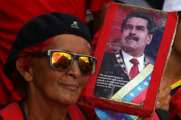 Meeting in support of Venezuelan President Maduro in Caracas- - CARACAS, VENEZUELA - MARCH 10 : People gather in front of the Miraflores Palace during a meeting organized by United Socialist Party of Venezuela (PSUV), in support of Venezuelan President Nicolas Maduro, in Caracas, Venezuela on March 10, 2019.