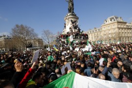 Protestors hold Algerian flags as they attend a demonstration against President Abdelaziz Bouteflika on the Place de la Republique, in Paris, France, March 10, 2019. REUTERS/Philippe Wojazer