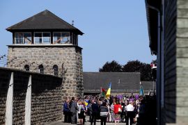 People gather at the memorial site of the former concentration camp Mauthausen ahead of the commemoration ceremony of liberation, Mauthausen, Austria May 06, 2018. REUTERS/Lisi Niesner