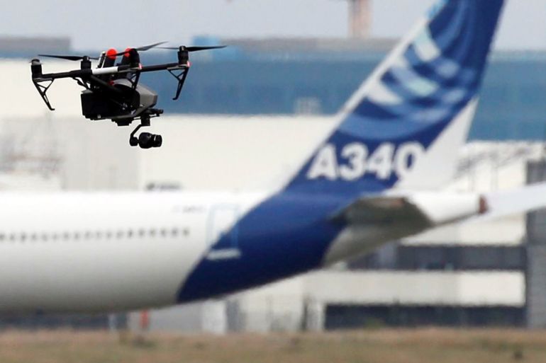 A drone flies near an Airbus A340 aircraft in Colomiers near Toulouse, France, October 19, 2017. REUTERS/Regis Duvignau