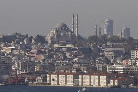 The Ottoman-era Suleymaniye mosque and skyscrapers behind its minarets are pictured from the Bosphorus bridge in Istanbul November 17, 2013. Look closely on a clear day, and the silhouette of Istanbul's historic peninsula, its minarets puncturing the sky, has changed for the first time in centuries. Construction lies close to Prime Minister Tayyip Erdogan's heart: vast real estate projects showcase Turkey's rising prosperity and serve as a vehicle for spreading wealt