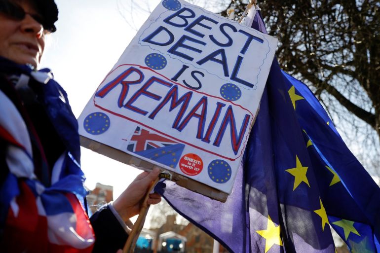An anti-Brexit protester holds a placard outside the Houses of Parliament in London, Britain March 14, 2019. REUTERS/Peter Nicholls