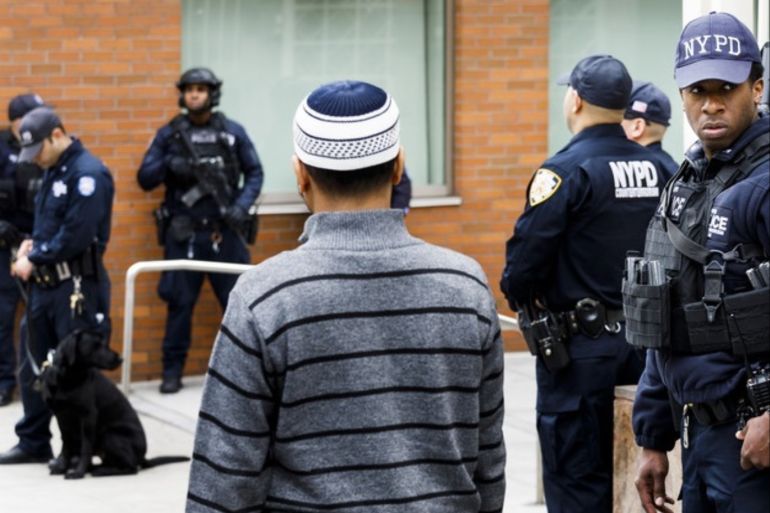 epa07440469 New York City police officers, including officers from the department's Counterterrorism Unit, provide security at the Islamic Cultural Center of New York as people arrive for Friday prayers in New York, New York, USA, 15 March 2019. Security in New York, and at sites around the world, was heightened following what was described as terrorist attacks at two mosques in New Zealand where 49 people were killed by a gunman and 20 more injured and in critical con