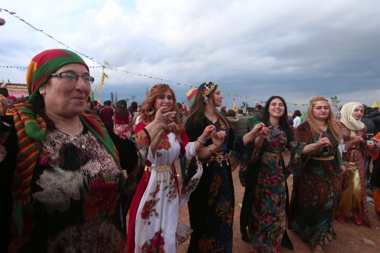 Kurdish women wearing traditional clothes dance during a celebration for the spring festival of Nowruz, in the northeastern Syrian city of Qamishli near the Turkish border, Syria March 21, 2017. REUTERS/Rodi Said