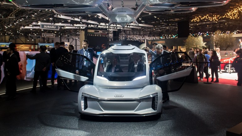 GENEVA, SWITZERLAND - MARCH 06: The 'Pop.up next' concept flying car, a hybrid vehicle that blends a self-driving car and passenger drone by Audi, italdesign and Airbus is seen at the 88th Geneva International Motor Show on March 6, 2018 in Geneva, Switzerland. Global automakers are converging on the show as many seek to roll out viable, mass-production alternatives to the traditional combustion engine, especially in the form of electric cars. The Geneva auto show is