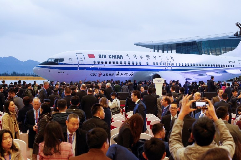 Guests attend a ceremony marking the 1st delivery of a Boeing 737 Max 8 passenger airplane to Air China at the Boeing Zhoushan completion center in Zhoushan, Zhejiang province, China, December 15, 2018. REUTERS/Thomas Peter