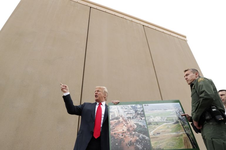 U.S. President Donald Trump speaks while participating in a tour of U.S.-Mexico border wall prototypes near the Otay Mesa Port of Entry in San Diego, California. U.S., March 13, 2018. REUTERS/Kevin Lamarque