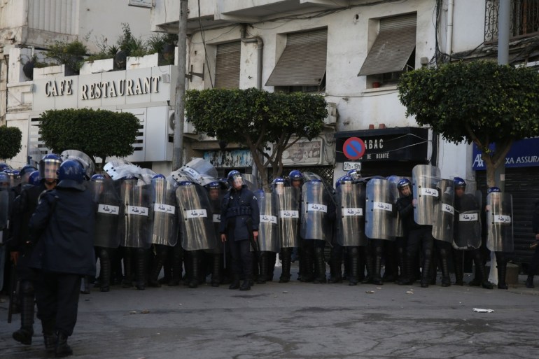 Algerian students protest against the fifth term of Abdelaziz Bouteflika- - ALGIERS, ALGERIA - FEBRUARY 26: Algerian riot policemen take security measures as Algerian university students protest against the fifth term of Abdelaziz Bouteflika, near the University of Algiers in Algiers, Algeria, on February 26, 2019. 81-year-old Abdelaziz Bouteflika, serving as the president since 1999, has announced on 19 February he will be running for a fifth term in presidential elect