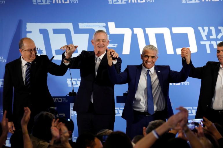 Benny Gantz, head of Resilience party and Yair Lapid, head of Yesh Atid, Moshe Yaalon and Gaby Ashkenazy react at the end of a news conference to announce the formation of their joint party, following an alliance between their parties, in Tel Aviv, Israel February 21, 2019. REUTERS/Amir Cohen
