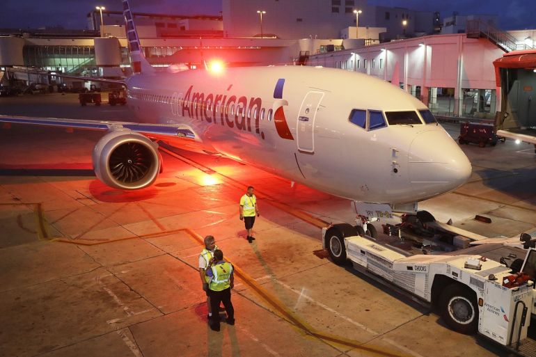 MIAMI, FL - MARCH 13: A grounded American Airlines Boeing 737 Max 8 is towed to another location at Miami International Airport on March 13, 2019 in Miami, Florida. American Airlines is reported to say that it will ground its fleet of 24 Boeing 737 Max planes and it plans to rebook passengers after the Federal Aviation Administration grounded the entire United States Boeing 737 Max fleet. Joe Raedle/Getty Images/AFP== FOR NEWSPAPERS, INTERNET, TELCOS &amp; TELEVISION USE