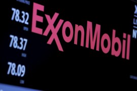 The logo of Exxon Mobil Corporation is shown on a monitor above the floor of the New York Stock Exchange in New York, December 30, 2015. REUTERS/Lucas Jackson/File Photo