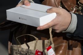 TOKYO, JAPAN - JANUARY 01: A customer shows a 'lucky bag' containing an Apple Inc. iPad Mini at a Bic Camera Inc. store on January 1, 2016 in Tokyo, Japan. Many Japanese retail stores celebrate the new year of business by selling out the annual 'lucky bags' containing items worth much more than their price tag. (Photo by Tomohiro Ohsumi/Getty Images)