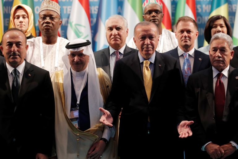 Turkish President Tayyip Erdogan poses for a group photo with Secretary General of OIC Yousef bin Ahmad Al-Othaimeen, New Zealand's Foreign Minister Winston Peters and Turkish Foreign Minister Mevlut Cavusoglu during an emergency meeting of the Organisation of Islamic Cooperation (OIC) in Istanbul, Turkey, March 22, 2019. REUTERS/Murad Sezer