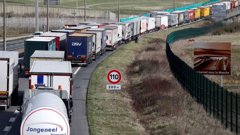 Trucks queue as French Customs Officers increase controls on transported goods to protest the lack of resources as the Brexit date approaches, in Coquelles, France, March 13, 2019. REUTERS/Pascal Rossignol