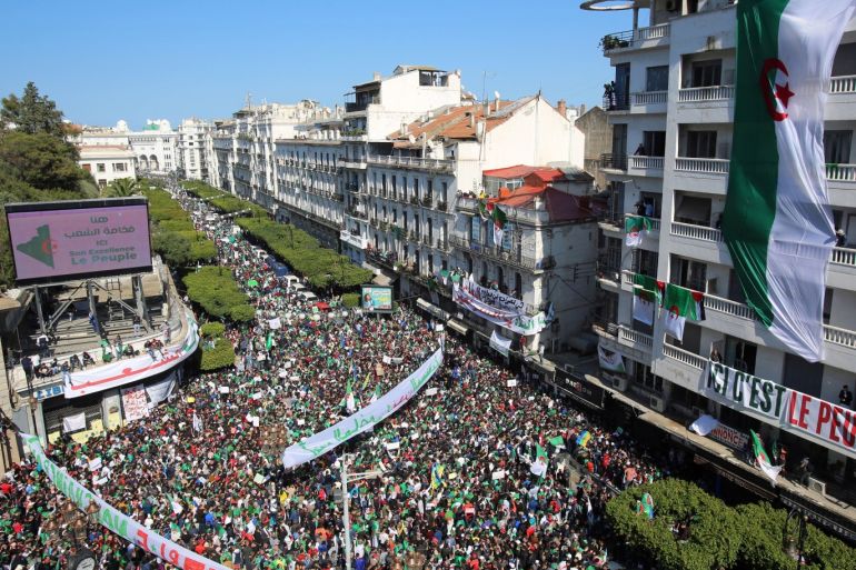 People carry national flags and banners during a protest to demand the resignation of President Abdelaziz Bouteflika, in Algiers, Algeria March 29, 2019. REUTERS/Ramzi Boudina