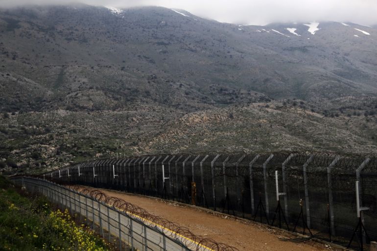 Fences are seen on the ceasefire line between Israel and Syria in the Israeli-occupied Golan Heights March 25, 2019. REUTERS/Ammar Awad