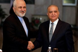 Iraqi Foreign Minister Mohamed Ali Alhakim shakes hands with his Iranian counterpart Mohammad Javad Zarif after a news conference, in Baghdad, Iraq March 10, 2019. REUTERS/Khalid Al-Mousily