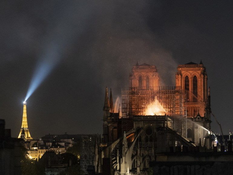 PARIS, FRANCE - APRIL 15: (EDITOR'S NOTE: Re-transmission with alternate crop) Flames and smoke are seen billowing from the roof at Notre-Dame Cathedral on April 15, 2019 in Paris, France. A fire broke out on Monday afternoon and quickly spread across the building, collapsing the spire. The cause is yet unknown but officials said it was possibly linked to ongoing renovation work. (Photo by Veronique de Viguerie/Getty Images)