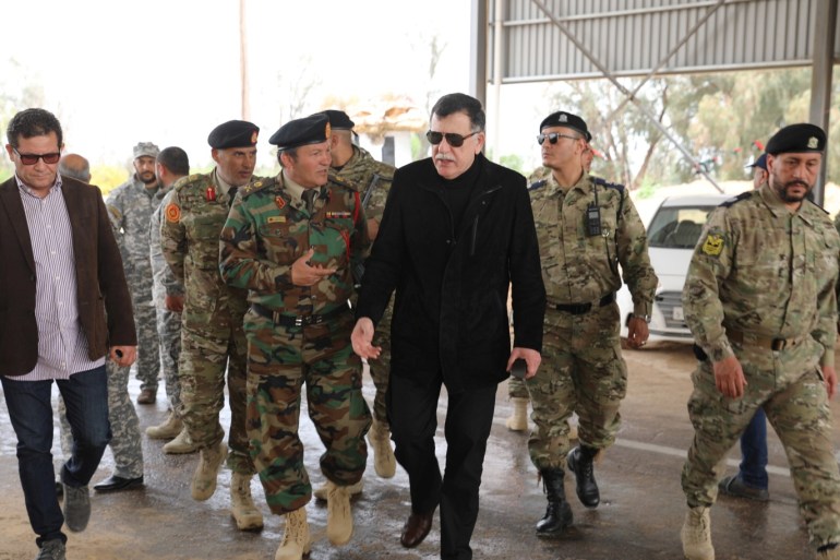 Libyan Prime Minister Fayez al-Sarraj arrives to the check point Gate 27, after retaking it from Haftar forces, in west of Tripoli, Libya April 05, 2019. REUTERS/Hani Amara