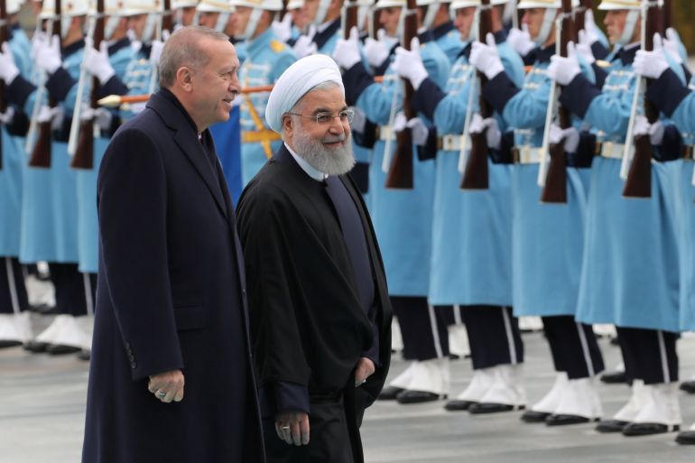 Turkish President Tayyip Erdogan and his Iranian counterpart Hassan Rouhani review a guard of honour during a welcoming ceremony at the Presidential Palace in Ankara, Turkey, December 20, 2018. REUTERS/Umit Bektas