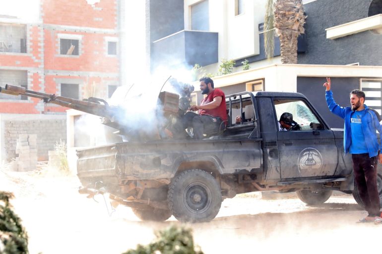A member of the Libyan internationally recognised government forces fires during a fight with Eastern forces in Ain Zara, Tripoli, Libya April 25, 2019. REUTERS/Hani Amara