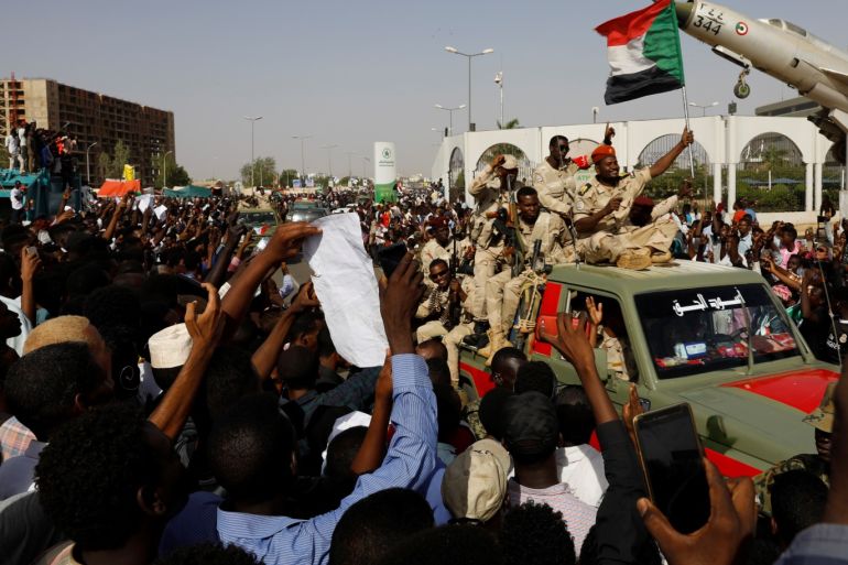 Sudanese soldiers are seen on their vehicles as they move with a military convoy outside the defense ministry compound in Khartoum, Sudan, April 25, 2019. REUTERS/Umit Bektas