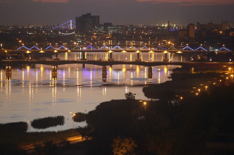 BAGHDAD, IRAQ - APRIL 13: Bridges span the Tigris River into the high-security Green Zone (L), on April 13, 2015 in Baghdad, Iraq. Baghdad has again come to life at night following the February lifting of the 12-year old evening curfew. Despite the continued risk of terror attacks and an escalating military offensive with ISIS extremists not far from the capitol, Baghdadis have taken to the nocturnal streets throughout the city. (Photo by John Moore/Getty Images)