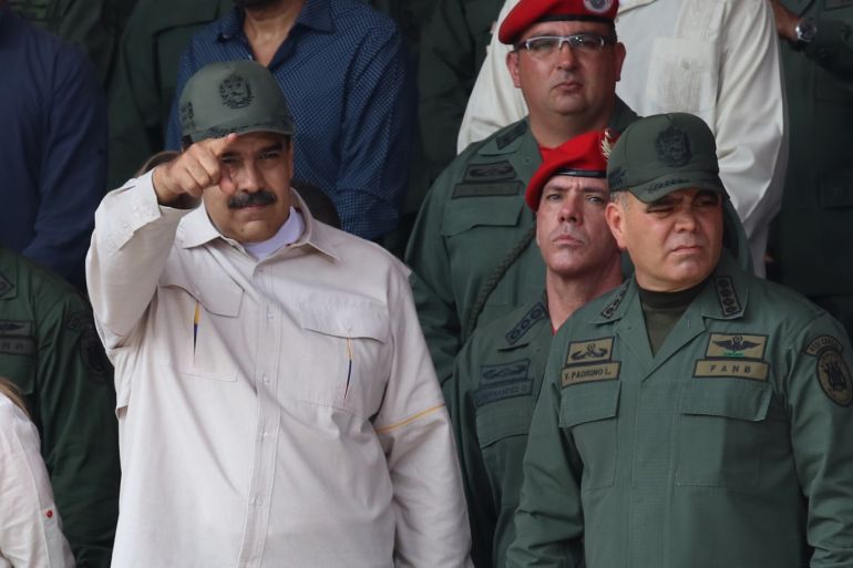 President of Venezuela Nicolas Maduro- - CARACAS, VENEZUELA - APRIL 13 : President of Venezuela, Nicolas Maduro (L) and Minister of Defense for the National Armed Forces of Venezuela Vladimir Padrino Lopez (R) attend a military parade on 'National Bolivarian Militia Day' at Los Proceres in Caracas, Venezuela, on April 13, 2019.