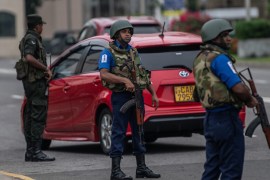 COLOMBO, SRI LANKA - APRIL 27: Sri Lankan security personnel stand in the road as they prepare to stop and search vehicles on April 27, 2019 in Colombo, Sri Lanka. More than 253 people were killed on Easter Sunday after coordinated terror attacks on three churches and three luxury hotels in the Colombo area and eastern city of Batticaloa, injuring hundreds. Based on reports, six foreign police agencies and Interpol, including Scotland Yard from the UK and the FBI from the US, are assisting local police as the Islamic State group claimed responsibility for the attacks although there has been no public evidence of direct involvement. (Photo by Carl Court/Getty Images)